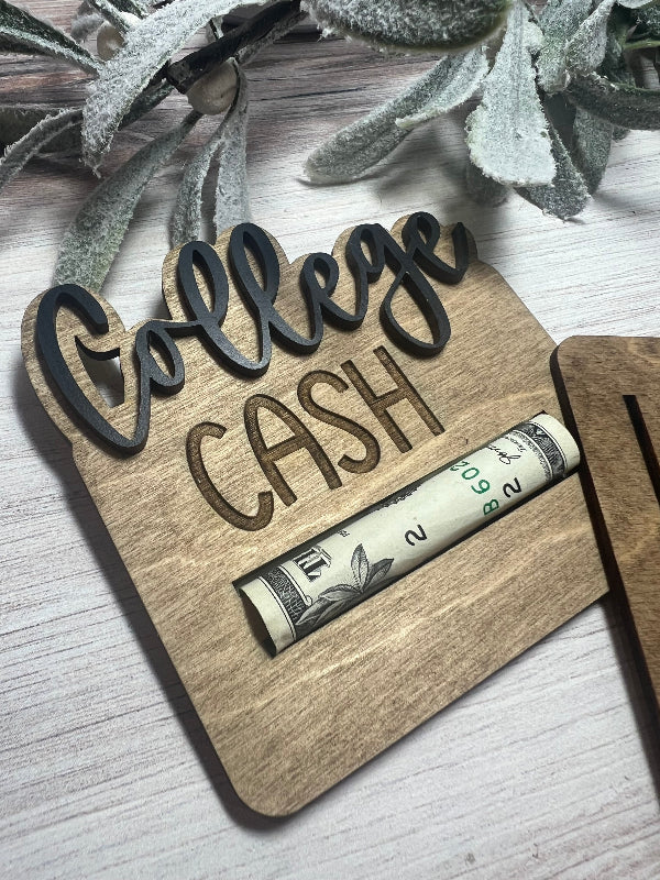 Wooden "college cash" cash holder on a light wooden surface with plants.