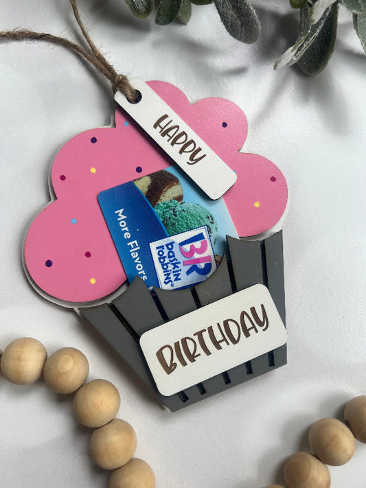 Pink cupcake-shaped gift tag with 'Happy Birthday' text and a gift card inside, on a light background.