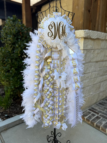Single Deluxe senior Homecoming Mum in white and gold.  Double boas, custom monogram and braids.