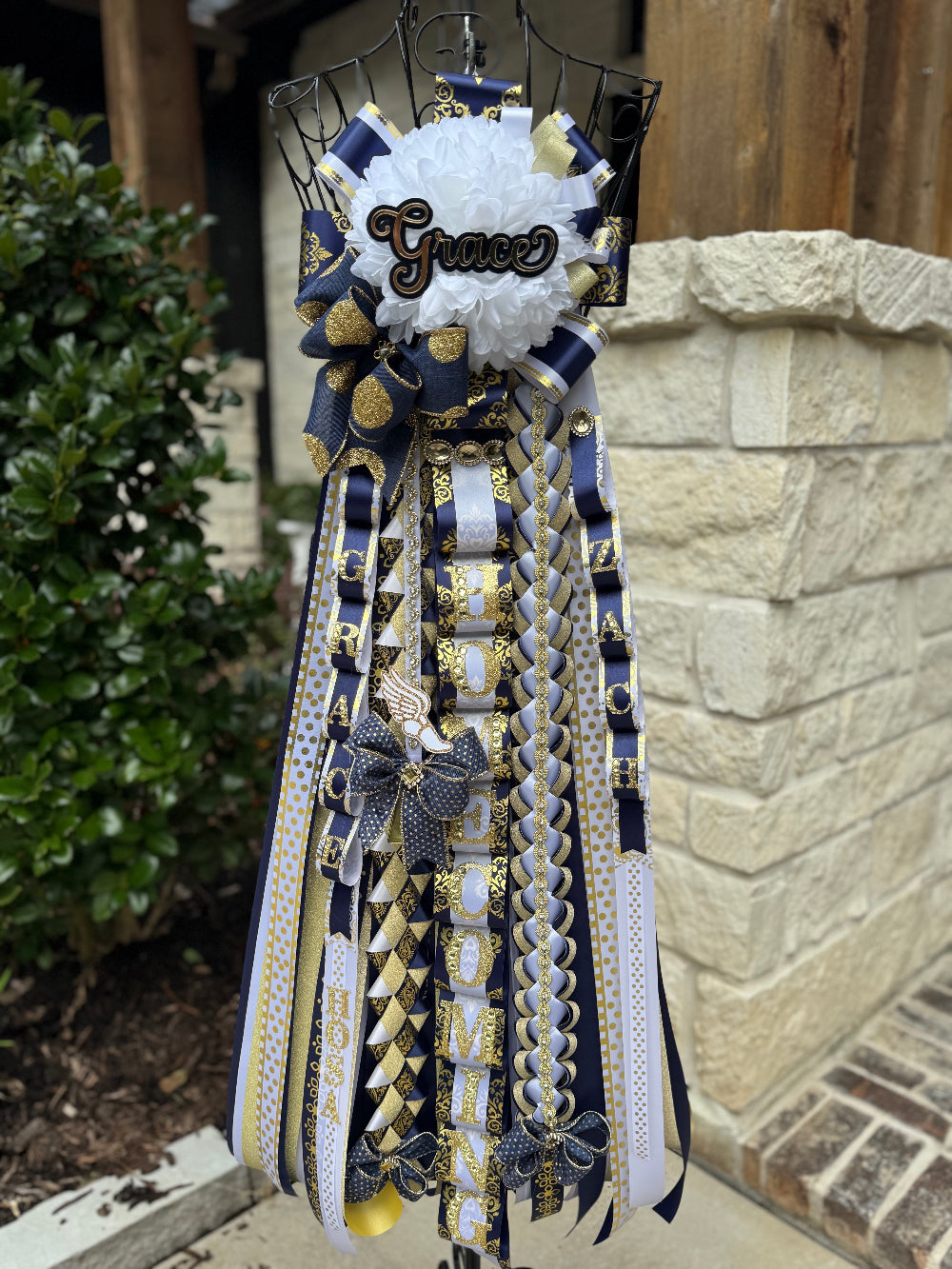 Single Homecoming Mum in navy, white and gold for Lake Creek High School
