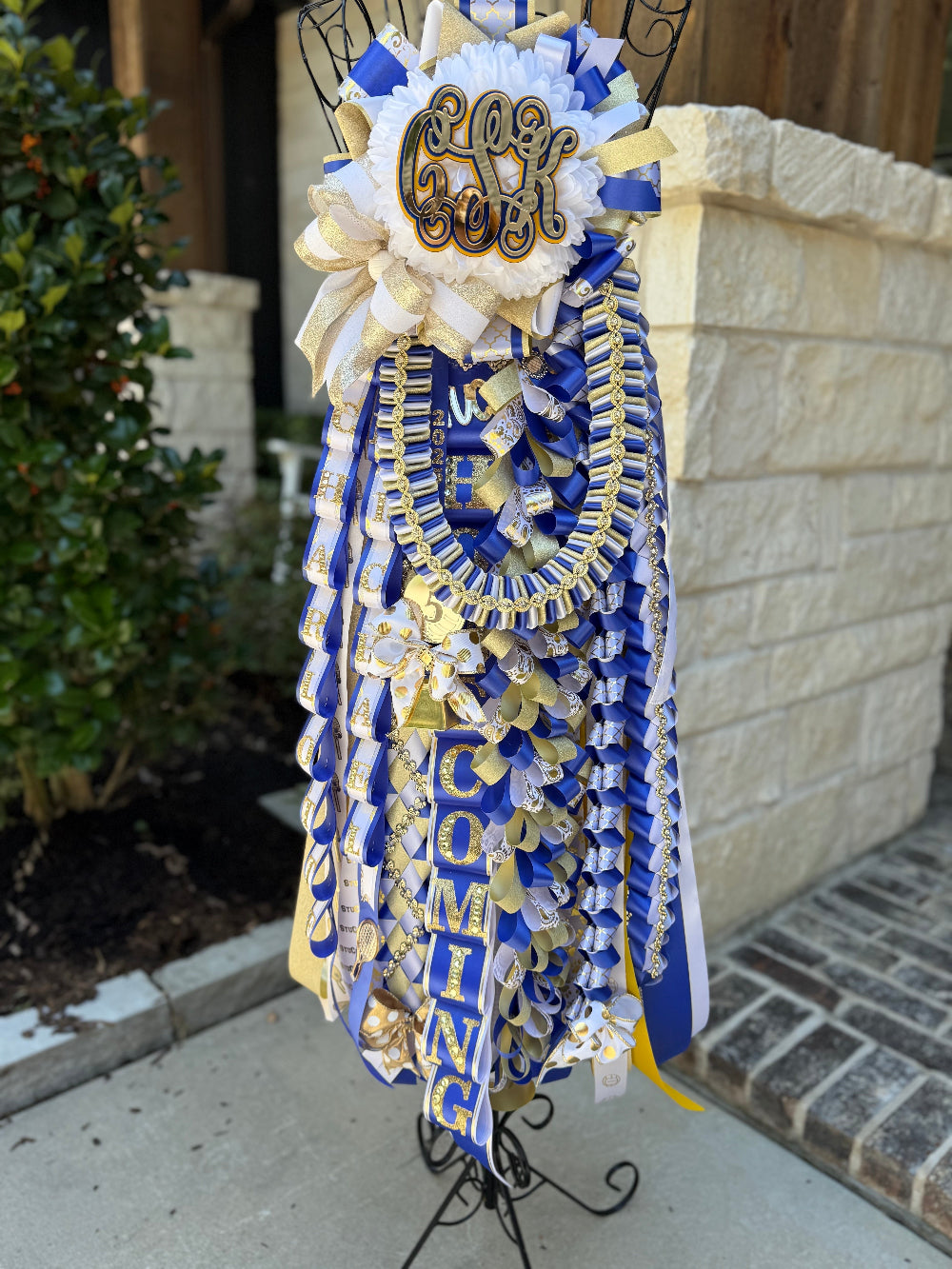 Single Homecoming Mum in royal, white and gold for Klein High School.  Custom monogram and braids.